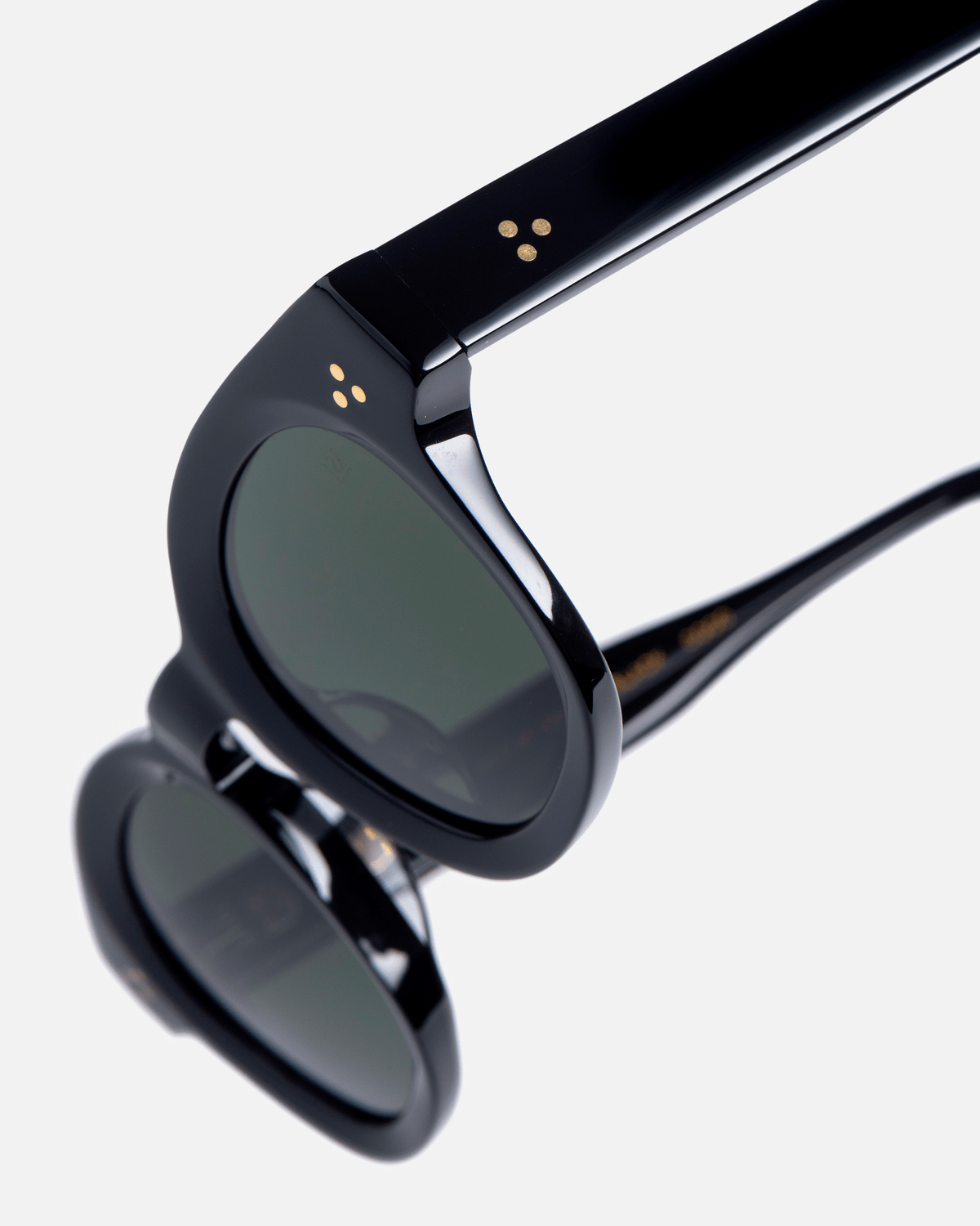 Coco black round sunglasses with black lenses, angled view