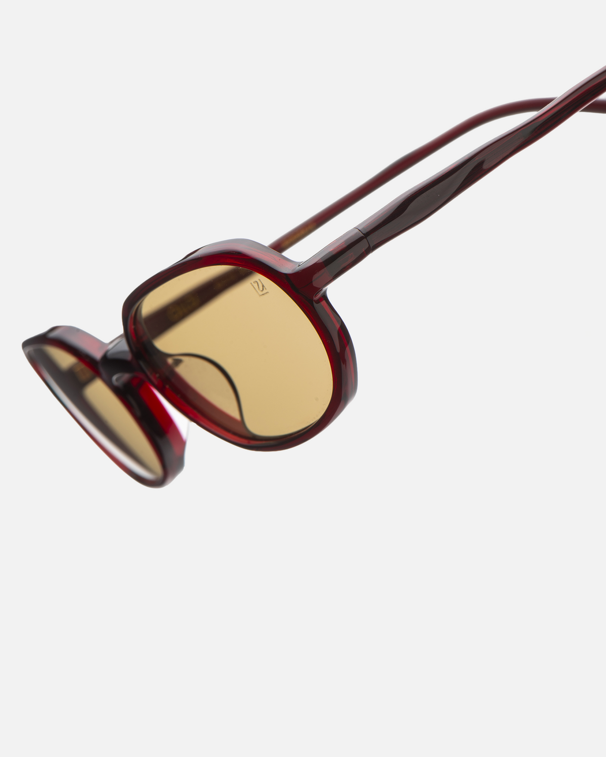 Seda burgundy 90s oval sunglasses with yellow lenses, angled view
