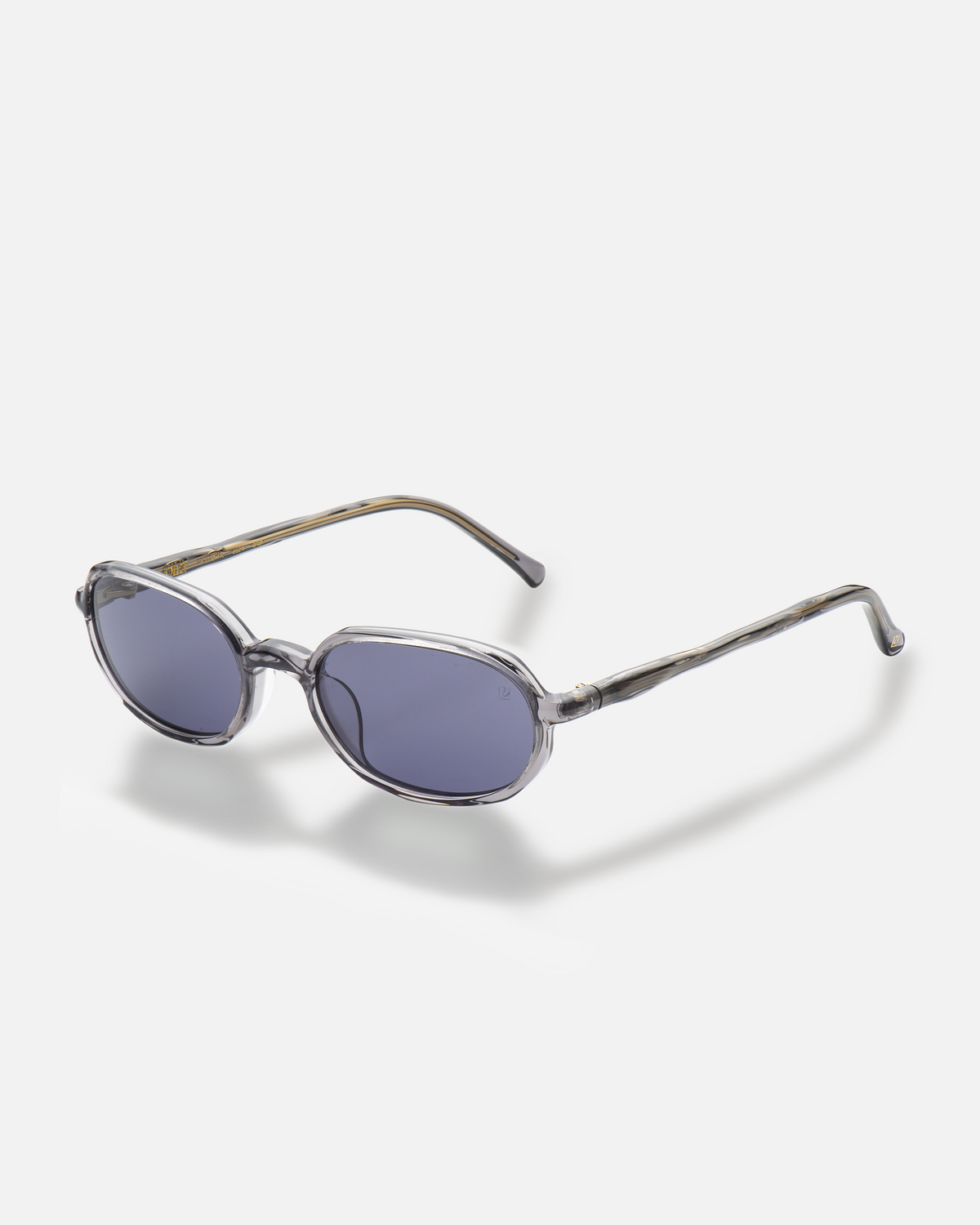 Seda gray 90s oval sunglasses with dark purple lenses, side view