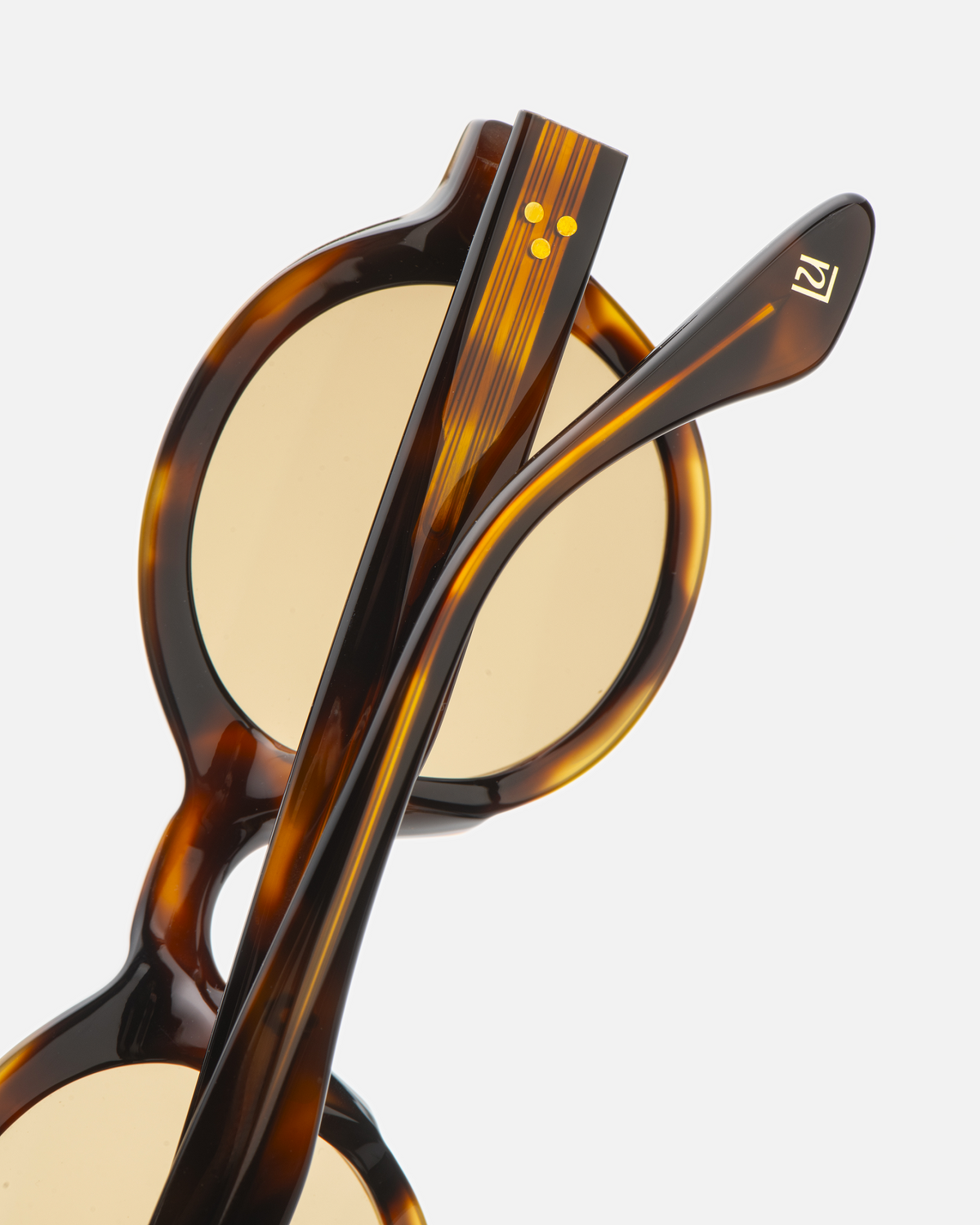 Umi tortoise narrow round sunglasses with yellow lenses, angled view