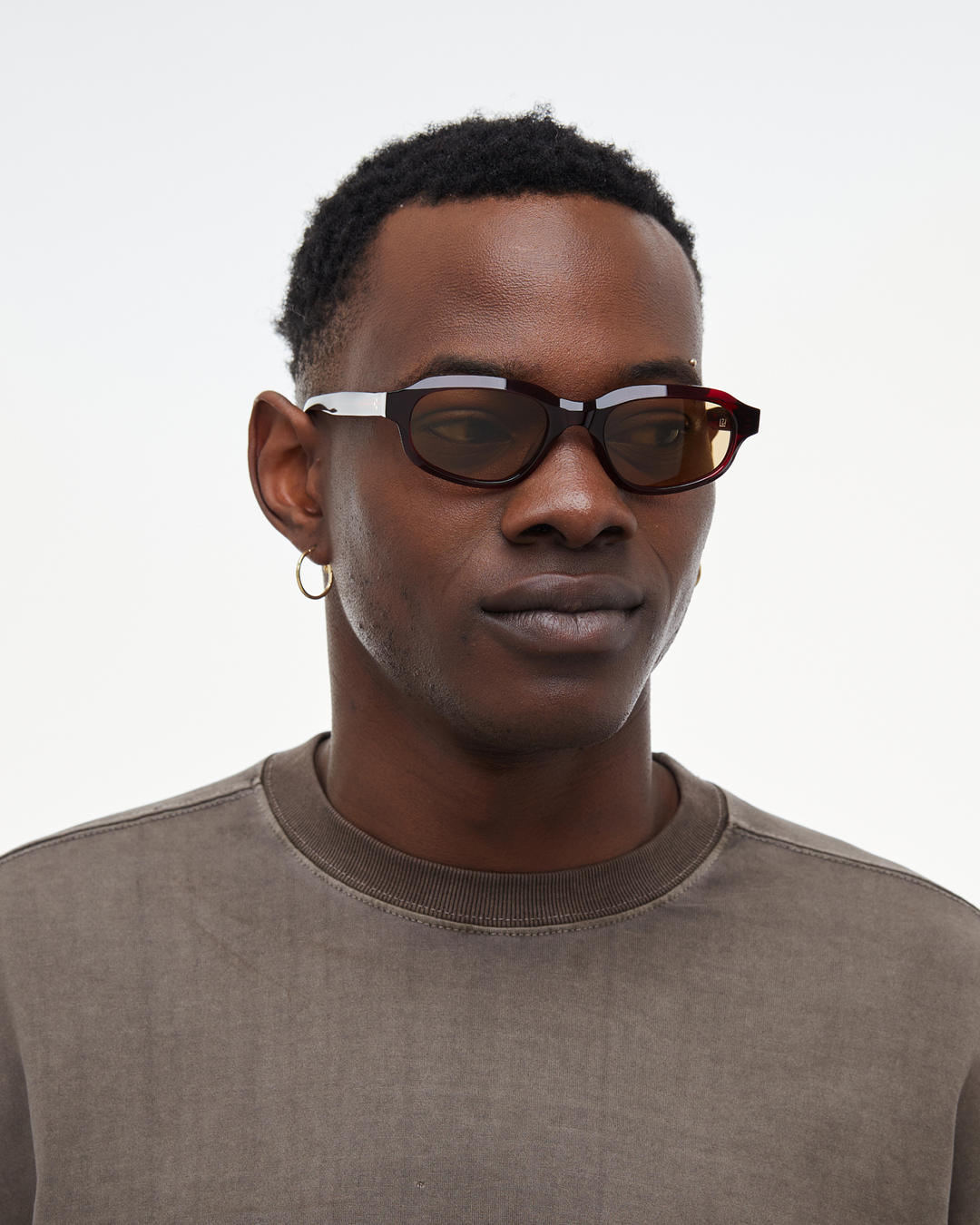 Man wearing Agaté burgundy oval cat-eye sunglasses with yellow lenses, look 3