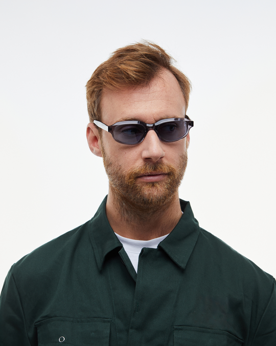 Man wearing Agaté gray oval cat-eye sunglasses with light blue lenses