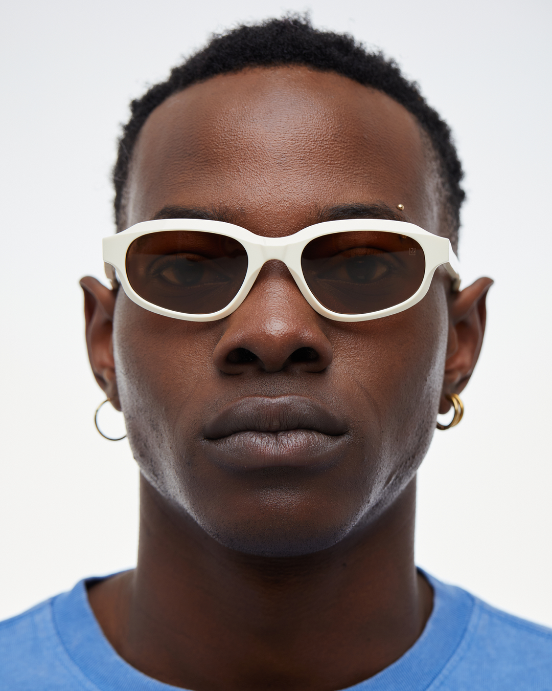 Man wearing Agaté white oval cat-eye sunglasses with brown lenses, look 2