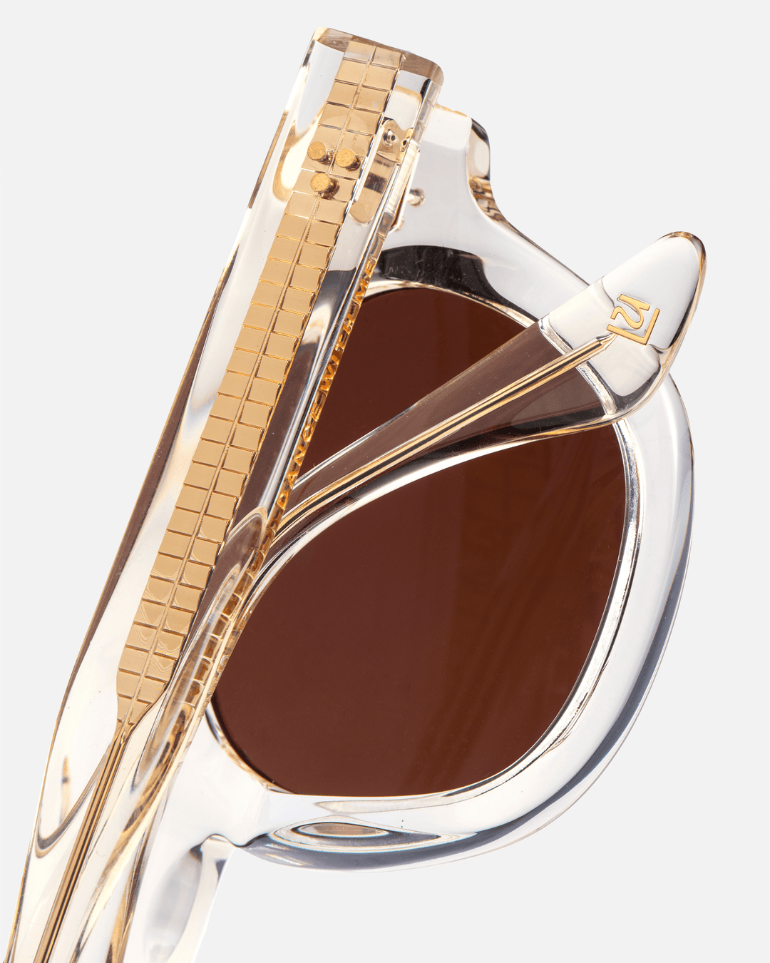 Coco clear round sunglasses with brown lenses, angled view