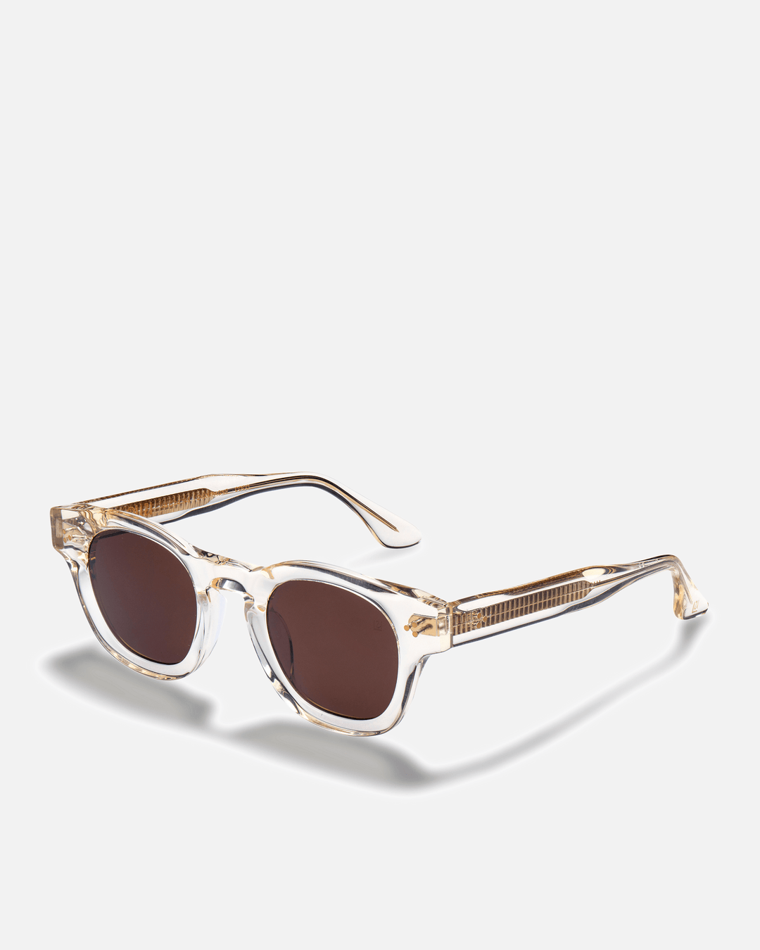 Coco clear round sunglasses with brown lenses, side view