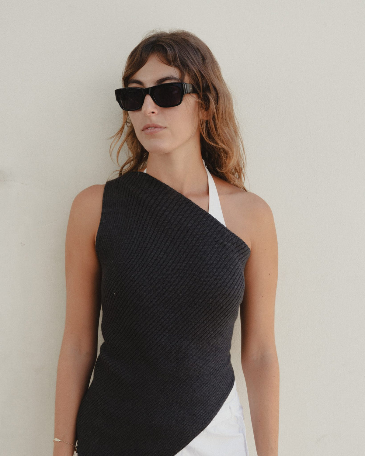 Woman wearing Massa black wayfarer sunglasses with black lenses