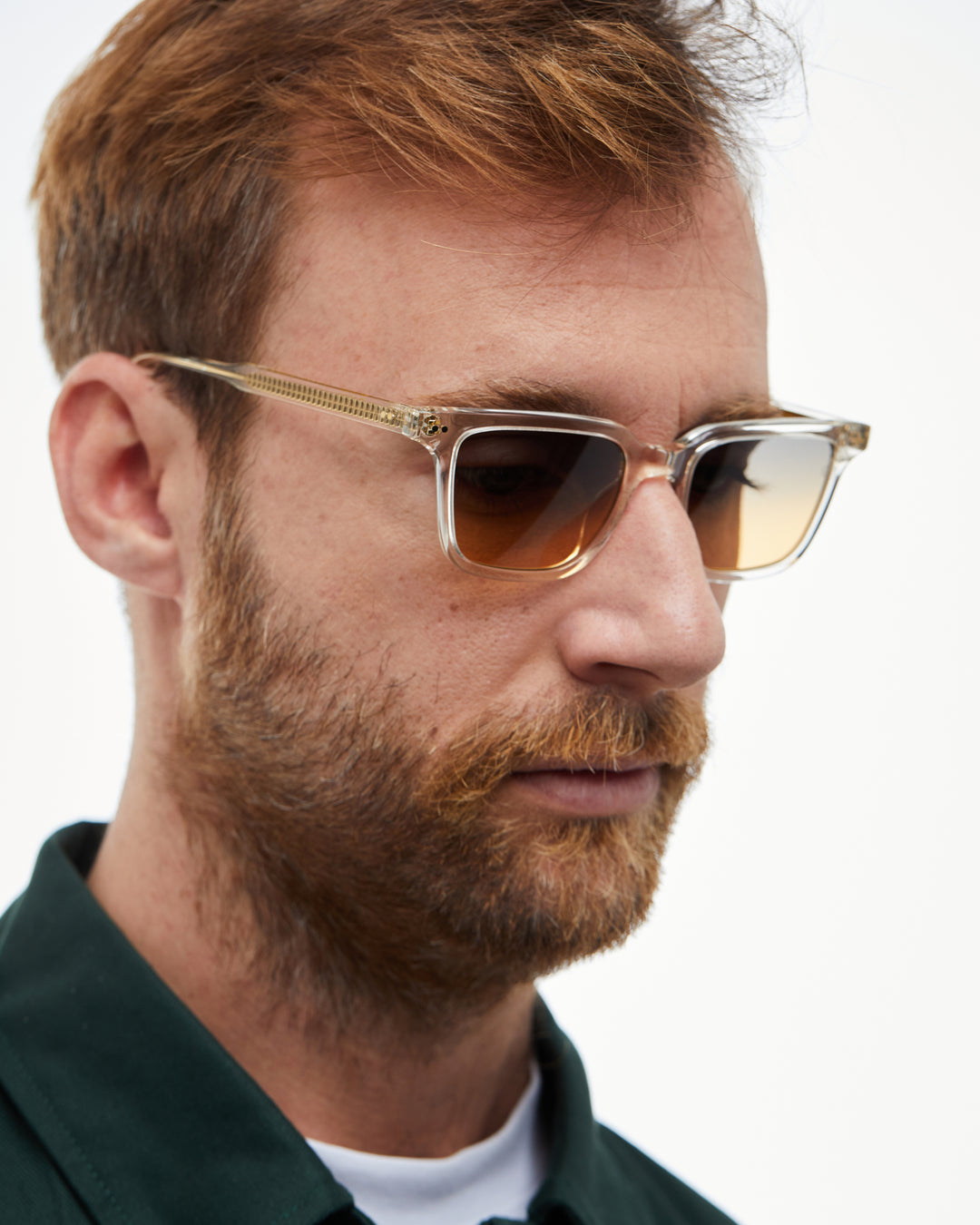 Man wearing Pepino clear rectangle sunglasses with gradient orange-to-blue lenses, look 6