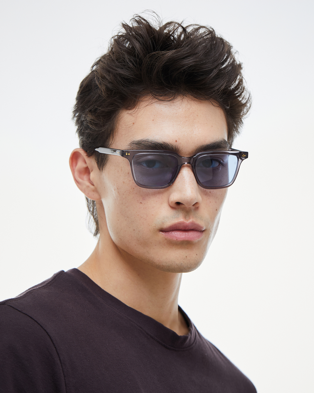 Man wearing Pepino gray rectangle sunglasses with light blue lenses, look 2