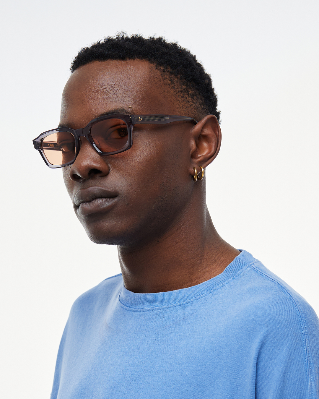 Man wearing Saguaro gray square sunglasses with orange lenses, look 2