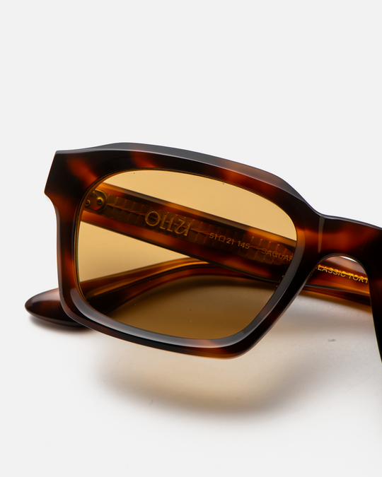 Saguaro tortoise square sunglasses with yellow lenses, angled view