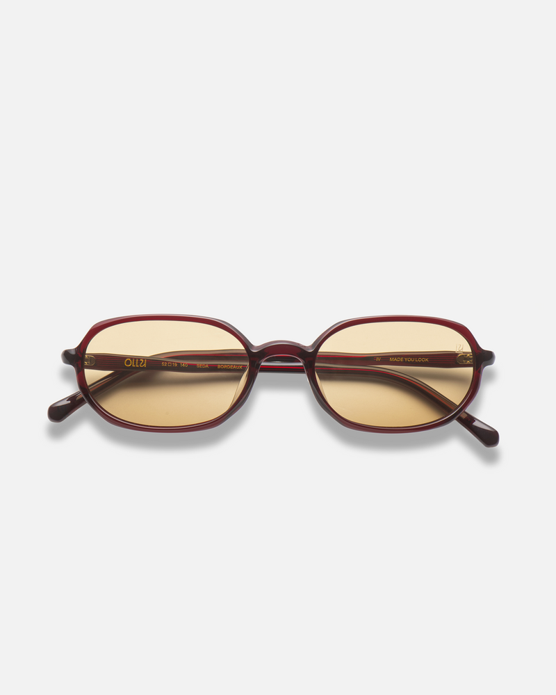 Seda burgundy 90s oval sunglasses with yellow lenses, front view