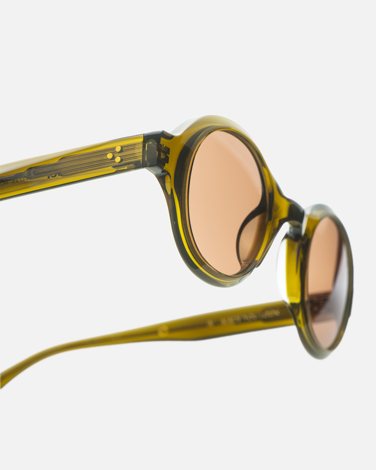 Umi olive brown narrow round sunglasses with brown lenses, angled view