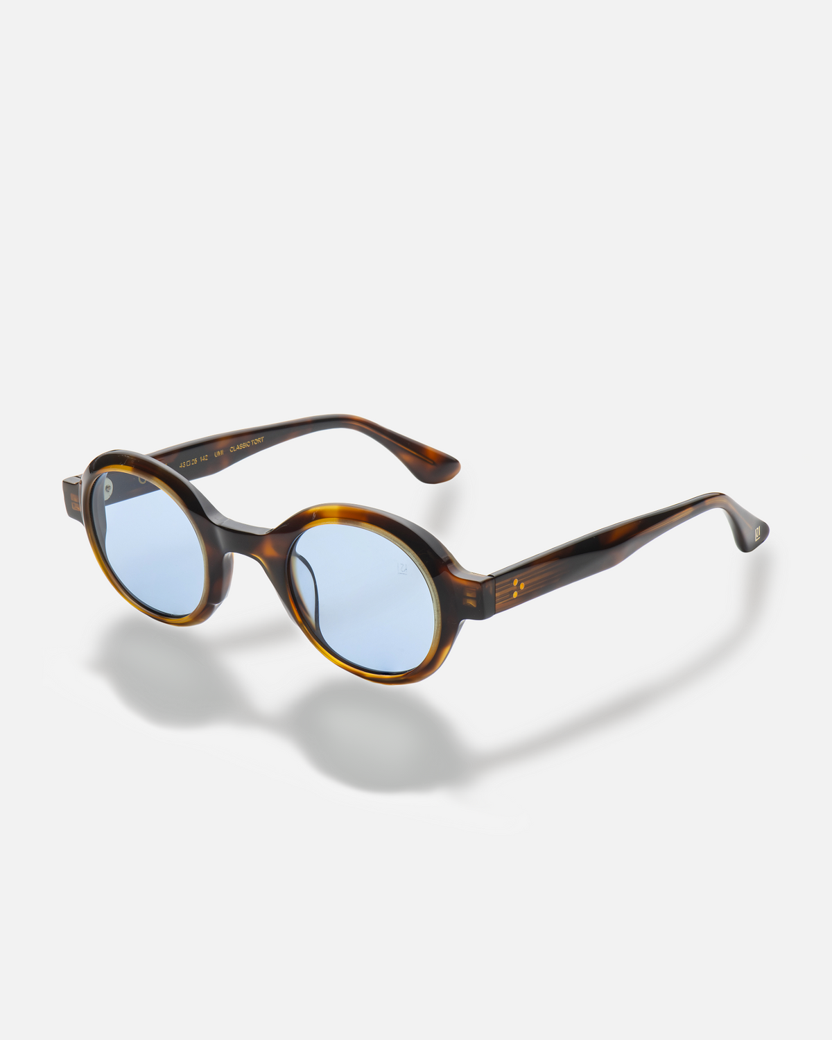 Umi tortoise narrow round sunglasses with blue lenses, side view