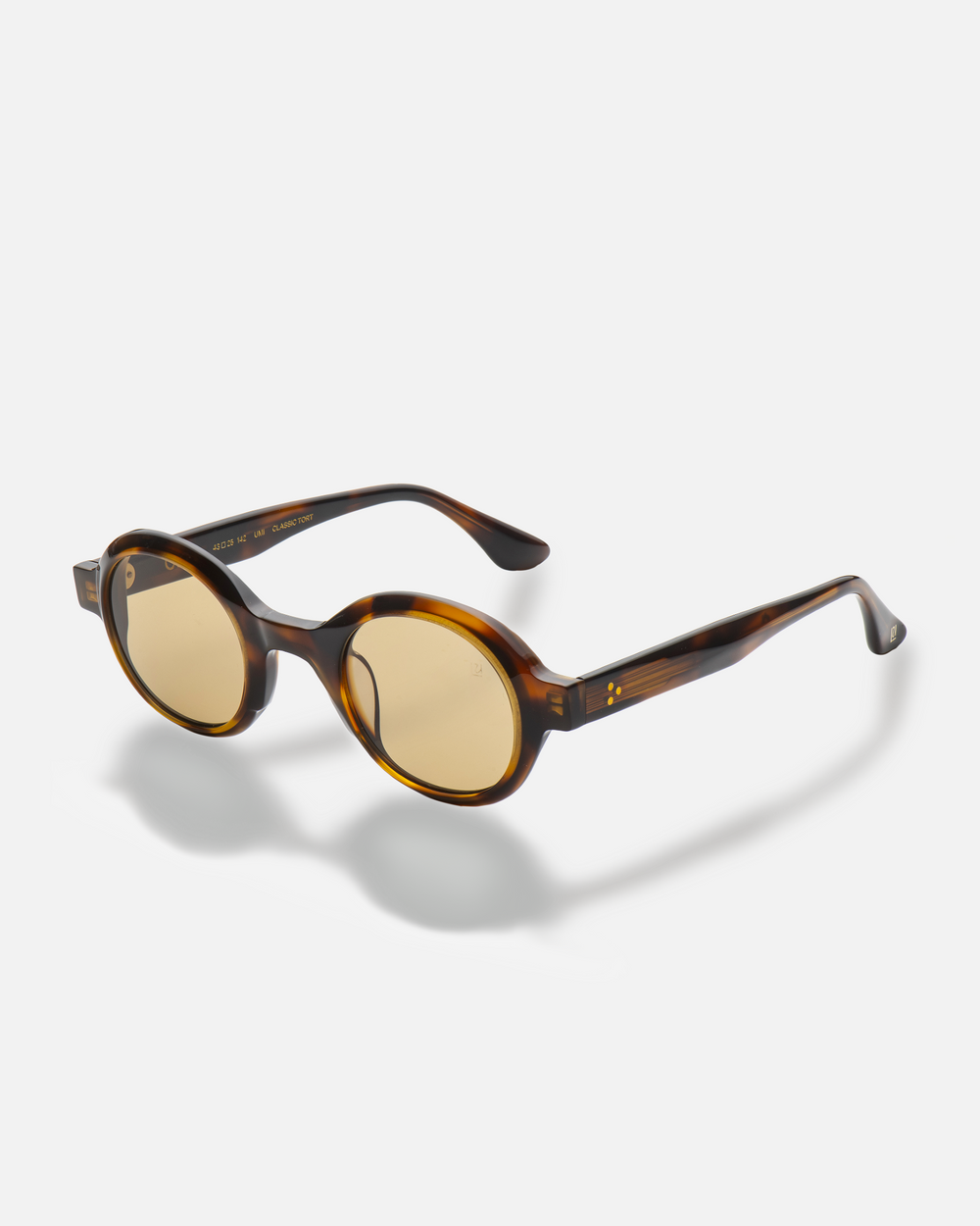 Umi tortoise narrow round sunglasses with yellow lenses, side view