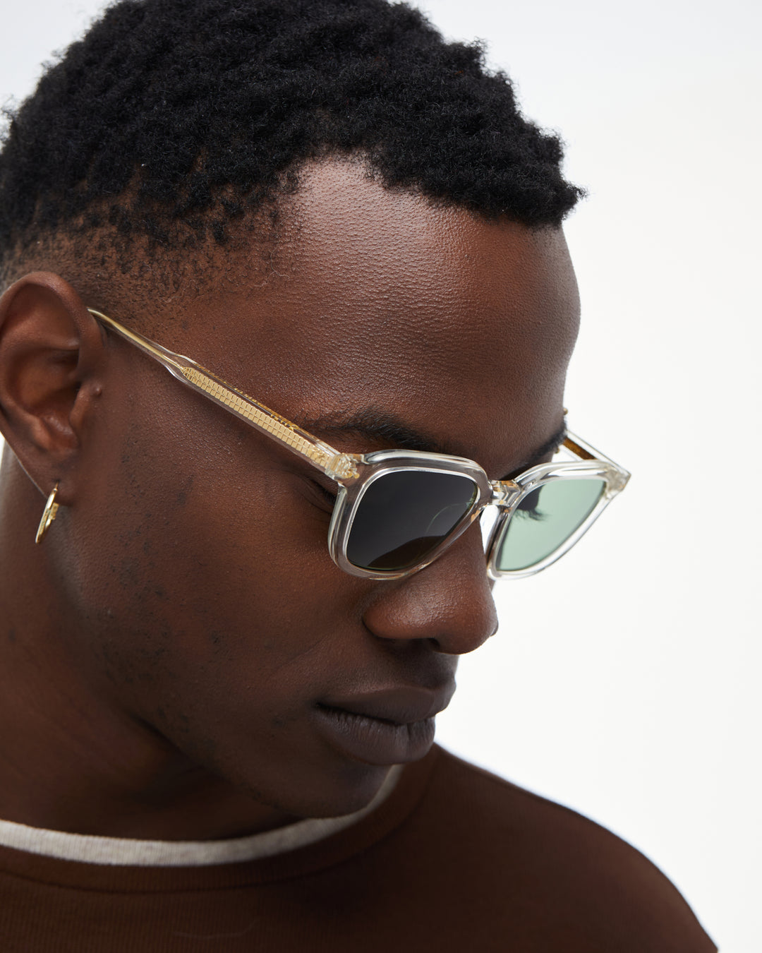 Man wearing Yuzu clear rounded square sunglasses with green lenses, look 4