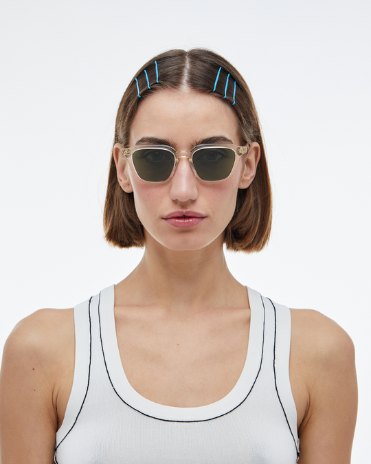 Woman wearing Yuzu clear rounded square sunglasses with green lenses